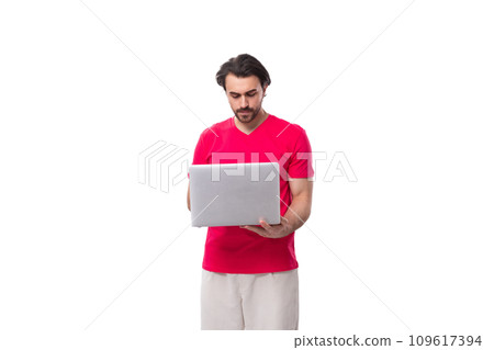 young male IT specialist holding a laptop in his hands on a white background with copy space young male IT specialist holding a laptop in his hands on a white background with copy space 109617394