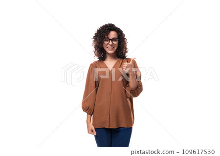 young confident caucasian lady with curly hair is wearing a brown blouse young confident caucasian lady with curly hair is wearing a brown blouse 109617530
