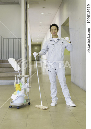 Portrait of a male cleaning worker in an office building, vertical position Photography cooperation: Ariake College of Education and Art 109618619