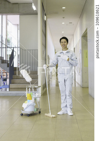 Portrait of a male cleaning worker in an office building, vertical position Photography cooperation: Ariake College of Education and Art Portrait of a male cleaning worker in an office building, vertical position Photography cooperation: Ariake College of Education and Art 109618621