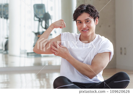 A man doing a fist pump at a sports facility A man doing a fist pump at a sports facility 109620626
