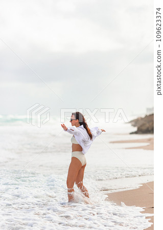 Happy woman on the beach vacation Happy woman on the beach vacation 109623374