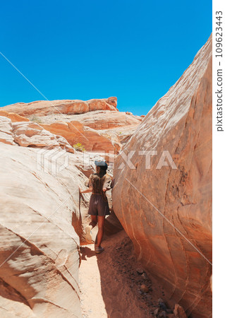 Young girl on trail at Fire Valley in Utah Young girl on trail at Fire Valley in Utah 109623443
