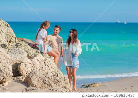 Happy family on the beach during summer vacation 109623455
