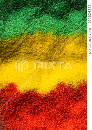 Vertical image of green, yellow and red powders with copy space background Vertical image of green, yellow and red powders with copy space background 109624521