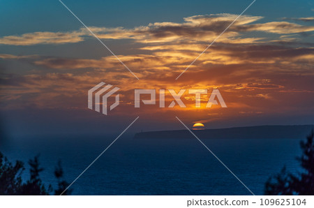 Majestic Lighthouse at Sunset on Cliffs Overlooking the Sea Majestic Lighthouse at Sunset on Cliffs Overlooking the Sea 109625104