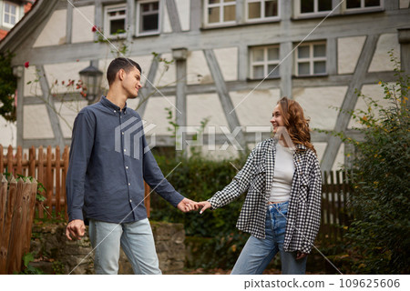 Warm Embrace of Teen Love in the Autumn Park. Capturing Teen Moments: Love Blossoms in Autumn's Embrace. Teenagers in Love: Embracing the Autumn Vibe 109625606