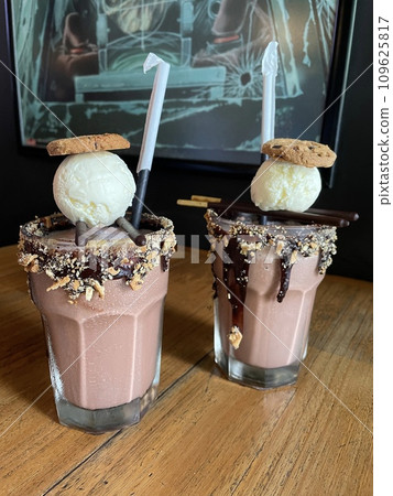Milkshake Chocolate with cookies and vanilla ice cream toppings Milkshake Chocolate with cookies and vanilla ice cream toppings 109625817