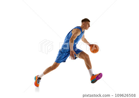Young man, athlete in motion, basketball player during game, practicing isolated over white background. Sport concept Young man, athlete in motion, basketball player during game, practicing isolated over white background. Sport concept 109626508