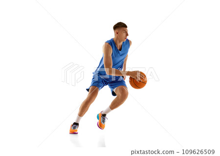 Young man in blue uniform playing baseball isolated over white background. Active hobby. Sport concept Young man in blue uniform playing baseball isolated over white background. Active hobby. Sport concept 109626509
