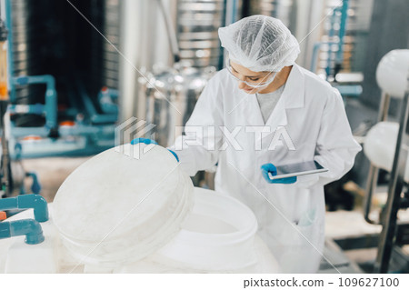 hygiene staff worker in foods and drinks clean factory. working women in water plant industry quality control check. hygiene staff worker in foods and drinks clean factory. working women in water plant industry quality control check. 109627100
