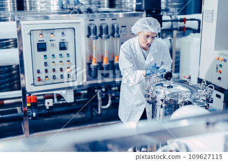 hygiene staff worker in foods and drinks clean factory. working women in water plant industry quality control check. hygiene staff worker in foods and drinks clean factory. working women in water plant industry quality control check. 109627115