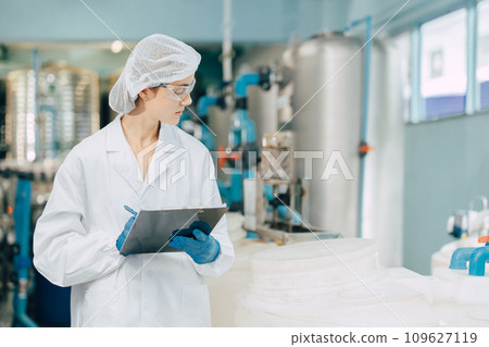 hygiene staff worker in foods and drinks clean factory. working women in water plant industry quality control check. hygiene staff worker in foods and drinks clean factory. working women in water plant industry quality control check. 109627119