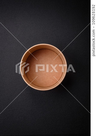 A cylindrical container made from environmentally friendly recycled materials for takeaway food A cylindrical container made from environmentally friendly recycled materials for takeaway food 109628192