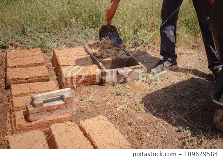 Isparta, Turkey - June 6, 2022: all stages of rose oil distillation work, Rose Petal Harvest, Manual picking. Roses used in perfume industry small production on a small family farm. 109629583