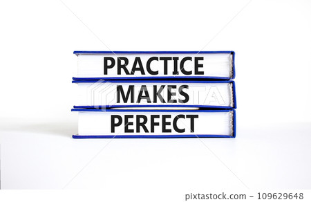 Practice makes perfect symbol. Concept words Practice makes perfect on beautiful book. Beautiful white table white background. Business practice makes perfect concept. Copy space. 109629648
