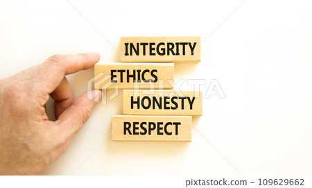 Integrity ethics honesty respect symbol. Concept word Integrity Ethics Honesty Respect on block. Beautiful white background. Businessman hand. Business integrity ethics honesty respect concept. 109629662