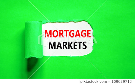 Mortgage markets symbol. Concept words Mortgage markets on beautiful white paper. Beautiful green paper background. Business mortgage markets concept. Copy space. Mortgage markets symbol. Concept words Mortgage markets on beautiful white paper. Beautiful green paper background. Business mortgage markets concept. Copy space. 109629713