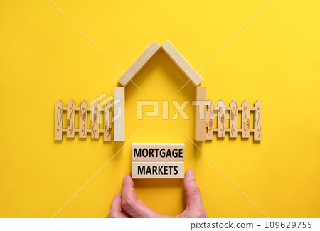 Mortgage markets symbol. Concept words Mortgage markets on beautiful wooden blocks. Beautiful yellow table yellow background. House model. Business mortgage markets concept. Copy space. Mortgage markets symbol. Concept words Mortgage markets on beautiful wooden blocks. Beautiful yellow table yellow background. House model. Business mortgage markets concept. Copy space. 109629755