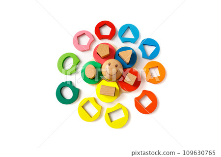 Wooden children's puzzle toy with colorful blocks of different shapes in form of funny sun, isolated on white background 109630765