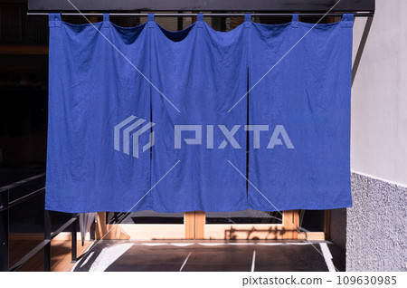 The curtain-like fabric that hangs in front of traditional Japanese restaurants and shops not only serves as a signboard, but holds a larger meaning, 109630985