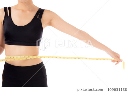 Portrait beautiful young asian woman measure tape with waist for weightloss with satisfied isolated. 109631188