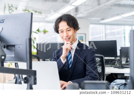 Middle-aged businessman working in the office Middle-aged businessman working in the office 109631212