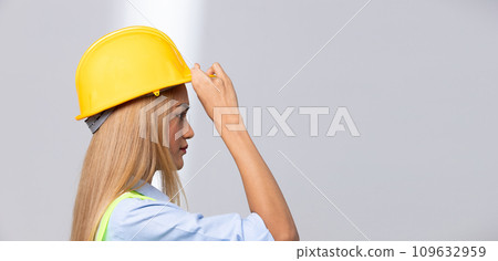 Female worker blonde hair lost her fingers from injured accident in industrial job. Woman engineer wear yellow hard hat show her lost fingers from work and insurance. White background isolated Female worker blonde hair lost her fingers from injured accident in industrial job. Woman engineer wear yellow hard hat show her lost fingers from work and insurance. White background isolated 109632959