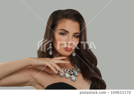 Stylish brunette fashion beauty portrait. Young woman with long dark healthy hair Stylish brunette fashion beauty portrait. Young woman with long dark healthy hair 109633178