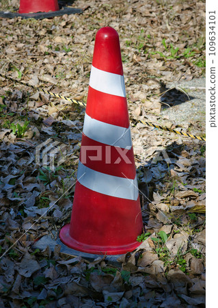 Triangular cone for construction work urging caution and regulation Triangular cone for construction work urging caution and regulation 109634101