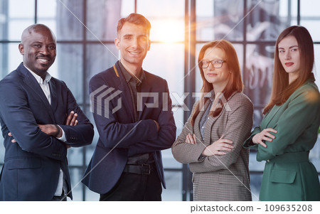 Portrait of four office workersr arms over their chest. 109635208
