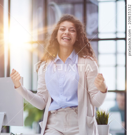 Happy woman screams make a winner gesture with clenched fists 109635332