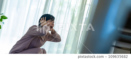 A woman in her 20s weighing herself A woman in her 20s weighing herself 109635682