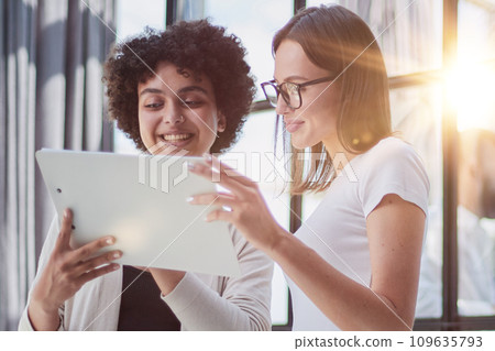 business woman with her staff in background at office business woman with her staff in background at office 109635793