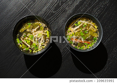Fish Broth with Greens, Sesame Seeds and Herbs 109635991