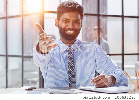 Person inviting you to shake hands before signing the document. Agreement, security, legality and contracting Person inviting you to shake hands before signing the document. Agreement, security, legality and contracting 109636283