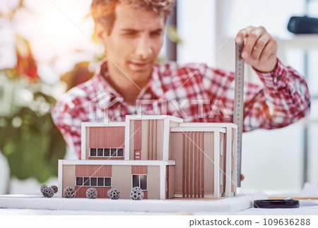 architect design working drawing sketch plans blueprints and making architectural construction model in architect studio 109636288