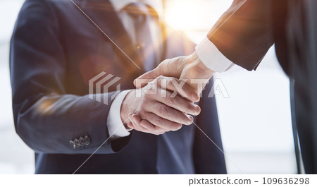People Shaking Hands at Meeting Close Up People Shaking Hands at Meeting Close Up 109636298