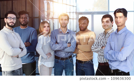 Positive multi racial corporate team posing looking at camera 109636300