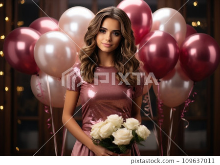 a young lady posing with 8 gold balloons with flowers 109637011