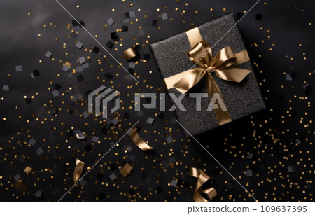 a christmas gift over a black background with gold confetti 109637395