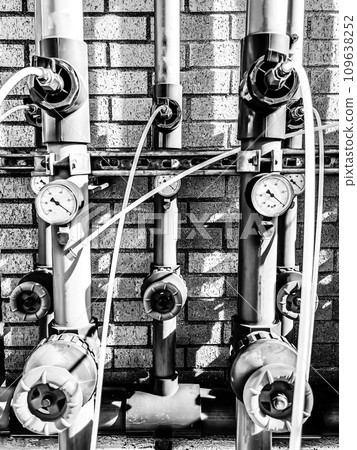 soil vapor extraction test well header with pressure gauge and sample line. soil vapor extraction test well header with pressure gauge and sample line. 109638252