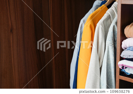 Wardrobe closet with different stylish clothes at home, copy space 109638276