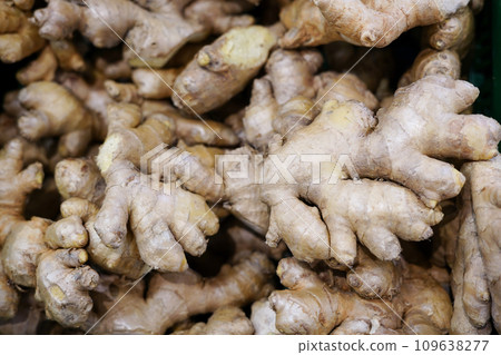 a lot of ginger in the store . A lot of Ginger Root. ginger harvest. ginger root food background. a lot of ginger in the store . A lot of Ginger Root. ginger harvest. ginger root food background. 109638277