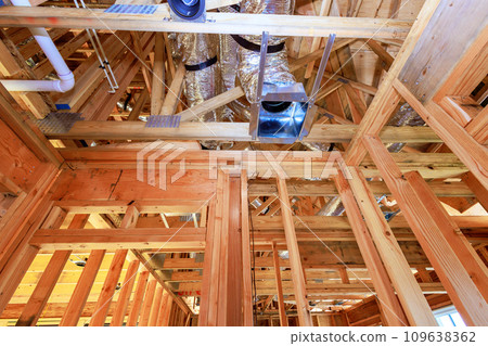 Installing HVAC conditioning, ventilation system of air metal duct pipeline for new home 109638362