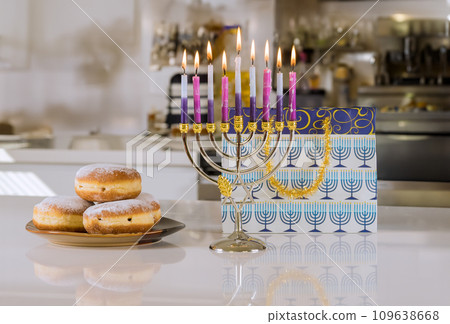 Hanukkah menorah lit in celebration of Jewish festival Hanukkiah candles lights Hanukkah menorah lit in celebration of Jewish festival Hanukkiah candles lights 109638668