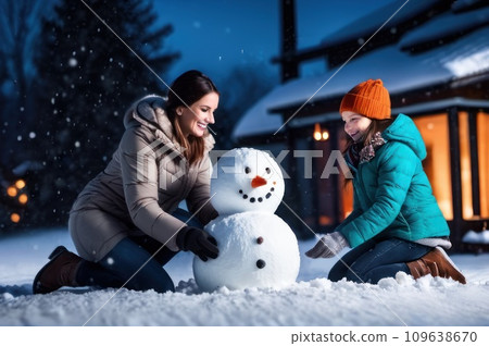 Happy Young Family Making Snowman in the Backyard of their Idyllic House. Mother with her children Puts Snowball together. Family Spending Time Together one Winter Evening. Christmas holiday concept. Happy Young Family Making Snowman in the Backyard of their Idyllic House. Mother with her children Puts Snowball together. Family Spending Time Together one Winter Evening. Christmas holiday concept. 109638670