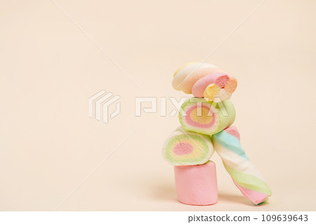 Marshmallows on light background with copy space, pyramid of candies Marshmallows on light background with copy space, pyramid of candies 109639643
