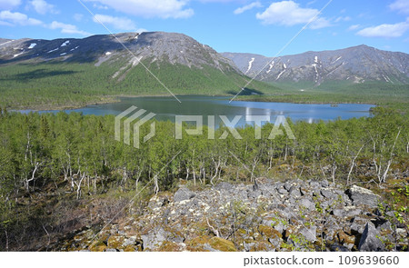 Beautiful lake surrounded by the Khibiny Mountains, Russia Beautiful lake surrounded by the Khibiny Mountains, Russia 109639660