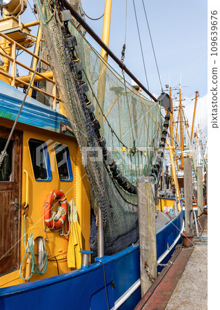 Colorful traditional old german fishing cutter boats moored